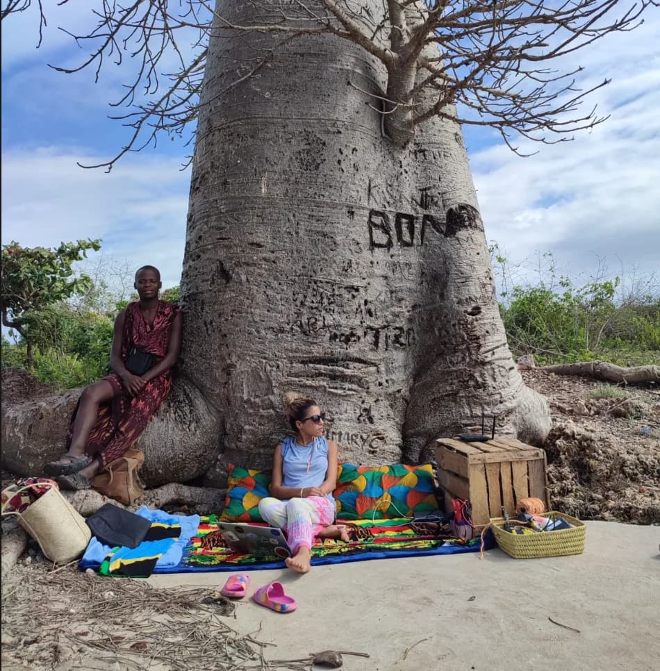 Hasna working beneath a baobab tree in Zanzibar